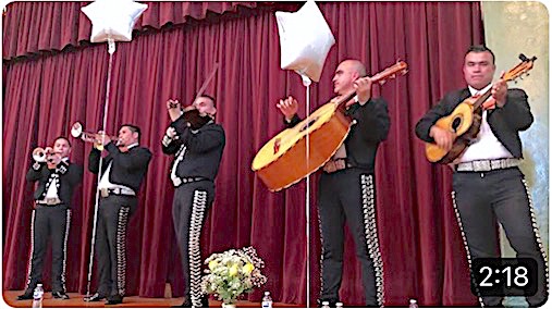 Mariachi Cisneros performing on stage for Quinceanera