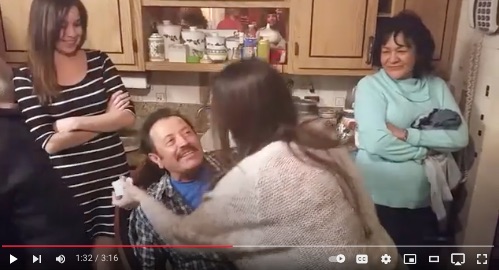image of daughters hugging dad at his 70th mariachi birthday surprise